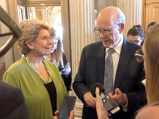 Sen. Debbie Stabenow (left) and Sen. Pat Roberts talk to reporters after the Senate passed its version of the farm bill Thursday. (DTN photo by Chris Clayton)